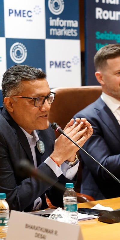 Men seated wearing VR headsets